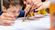 Young boy painting focused on painting on desk