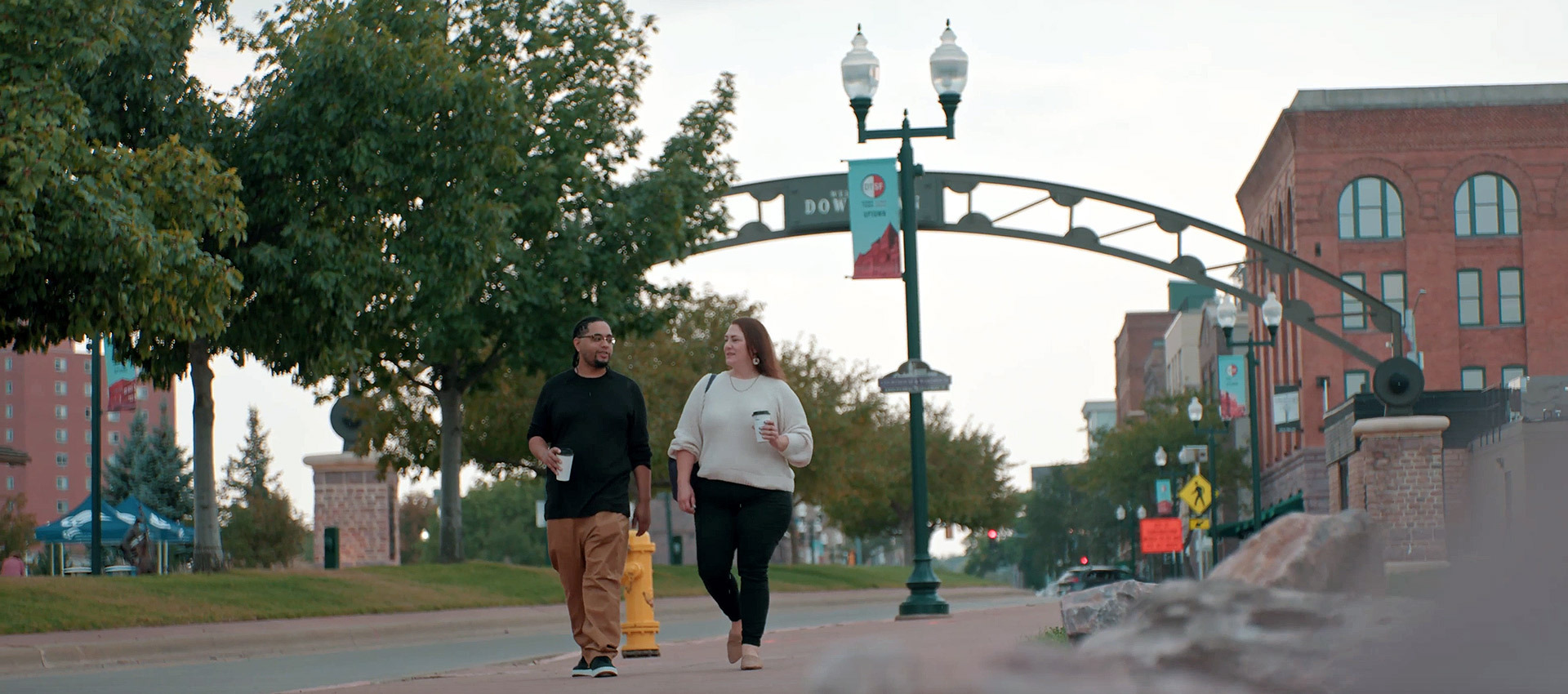 Interracial couple walking together in Downtown Sioux Falls