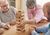 Elderly playing Jenga in retirement home